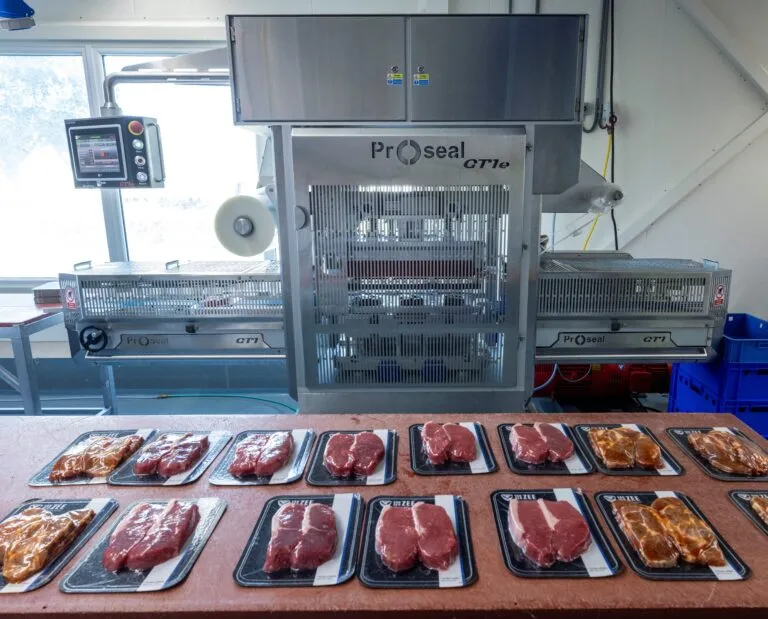 Proseal GT1e automatic tray sealer for packaging fresh meat in sealed trays.