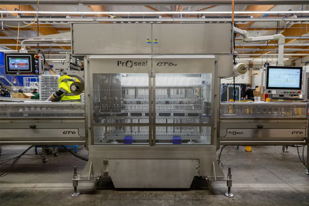 Proseal GT6 automatic tray sealing machine installed in an industrial food packaging facility.